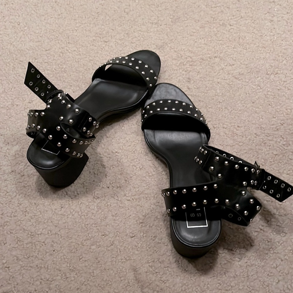 Size 9.5 buckled and studded sandies. Block heel, great for my tall gals!
